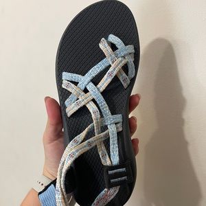 Black/ blue chacos with white orange and tan detailing